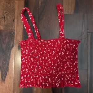 Ruched shirt with red with light pink flowers.